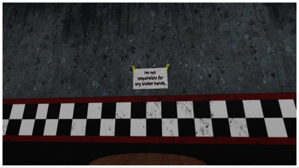 feature image for our one more night gear guide showing a grey wall with racer stripes near the bottom. Above that is a white note taped to the wall reading "im not responsible for any broken hands"